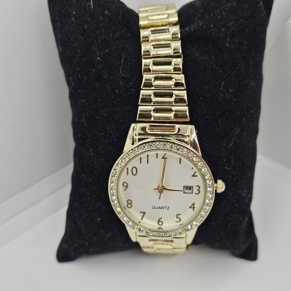 gold tone stretch watch with rhinestone case